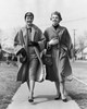 Two young women walking on a walkway and smiling Poster Print - Item # VARSAL2553497