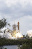 Space Shuttle Atlantis lifts off from its launch pad toward Earth orbit Poster Print