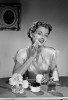 Woman applying face cream Poster Print - Item # VARSAL255418332