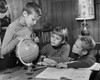 Three children looking at a globe in a room Poster Print - Item # VARSAL25516402