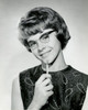 Portrait of a teenage girl smiling and holding a pencil Poster Print - Item # VARSAL2554130