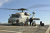 A U.S. Navy SH-60B Seahawk helicopter is refueled on the flight deck of USS Thach Poster Print - Item # VARPSTSTK104729M