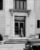 Woman entering a bank Poster Print - Item # VARSAL25525099