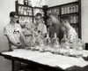 Four boys performing an experiment in a chemistry laboratory Poster Print - Item # VARSAL25518224