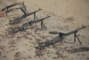 PK 7.62mm general-purpose machine guns and spent cartridges at the firing range in Kunduz, Afghanistan. A couple of RPK Kalashnikov hand-held machine guns are visible in the background Poster Print - Item # VARPSTTMO100440M