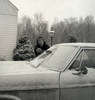 Woman cleaning car from snow Poster Print - Item # VARSAL255416500