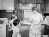 Mother reprimanding children in kitchen Poster Print - Item # VARSAL255419453