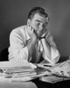 Businessman sitting in an office with his hands on his chin Poster Print - Item # VARSAL25519002