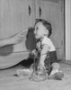 Baby boy caught with his hand in a cookie jar by his mother Poster Print - Item # VARSAL2559273