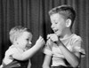 Two boys pulling a wishbone and smiling Poster Print - Item # VARSAL25516519A