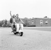 Young happy couple driving scooter Poster Print - Item # VARSAL255417805