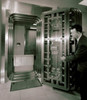 Side profile of a mature man opening a bank vault door Poster Print - Item # VARSAL2554360