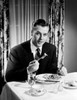 Man eating dinner Poster Print