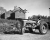 Woman sitting on a tractor Poster Print - Item # VARSAL25530451