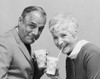 Portrait of a senior couple drinking from disposable cups Poster Print - Item # VARSAL25548861
