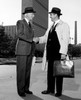 Businessmen shaking hands in downtown Poster Print - Item # VARSAL25535445