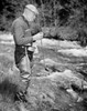 Senior man fishing in stream Poster Print - Item # VARSAL255419235