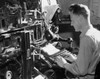 Side profile of a male worker operating a linotype machine Poster Print - Item # VARSAL25539089