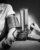 Doctor measuring the blood pressure of a patient Poster Print - Item # VARSAL25526427
