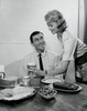 Side profile of a young woman serving food to a young man Poster Print - Item # VARSAL25541158