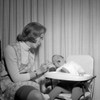 Mother feeding baby in highchair Poster Print - Item # VARSAL2556006
