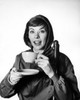 Portrait of a mid adult woman drinking from a tea cup Poster Print - Item # VARSAL25512618