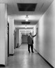 Mature businessman standing in corridor Poster Print - Item # VARSAL25548184