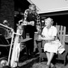 Mid adult man and mother having break from playing golf Poster Print - Item # VARSAL255417139