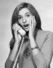 Portrait of a young woman talking on the telephone and looking surprised Poster Print - Item # VARSAL25524854