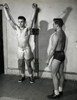 Young man exercising in a gym with another standing beside him Poster Print - Item # VARSAL25520447