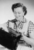 Studio portrait of mid adult woman opening purse Poster Print - Item # VARSAL255422840