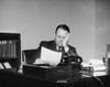 Businessman reading a document in an office Poster Print - Item # VARSAL25548372