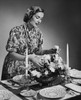 Young woman setting a dining table Poster Print - Item # VARSAL25514623A