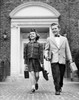 Schoolboy and a schoolgirl holding schoolbags and walking Poster Print - Item # VARSAL25518071B