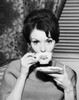 Portrait of a young woman drinking from a tea cup Poster Print - Item # VARSAL25512632