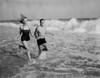 Young couple running in sea Poster Print - Item # VARSAL255421935