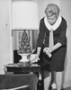 Mid adult woman cleaning a side table Poster Print - Item # VARSAL25541850