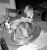Boy sitting at dining table and looking at roasted turkey on Thanksgiving Day Poster Print - Item # VARSAL255677