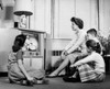 Mother with her three children watching television Poster Print - Item # VARSAL2551605