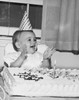 Birthday cake in front of a baby girl Poster Print - Item # VARSAL2559677