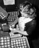 High angle view of a young woman examining eggs for freshness Poster Print - Item # VARSAL25529747