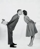 Side profile of a young couple kissing each other Poster Print - Item # VARSAL255697