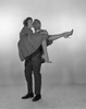 Man laughing and carrying woman  studio shot Poster Print - Item # VARSAL255417360