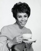 Portrait of a young woman holding a tea cup Poster Print - Item # VARSAL2553430