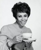 Portrait of a young woman holding a tea cup Poster Print - Item # VARSAL2553430