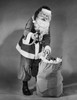 Portrait of Santa Claus standing with a sack of gifts and holding a Christmas present Poster Print - Item # VARSAL25526716 Portrait of Santa Claus standing with a sack of gifts and holding a Christmas present Poster Print - Item # VARSAL25526716