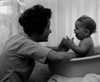 Mother playing with baby in baby bathtub Poster Print - Item # VARSAL2559876