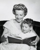 Portrait of son sitting on his mother's lap reading book Poster Print - Item # VARSAL2552462B