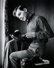 Side profile of a teenage boy polishing his shoes Poster Print - Item # VARSAL25517489