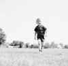 Little boy walking on field Poster Print - Item # VARSAL255424655